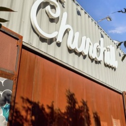 The essence of exceptional living the side of a large building with a sign